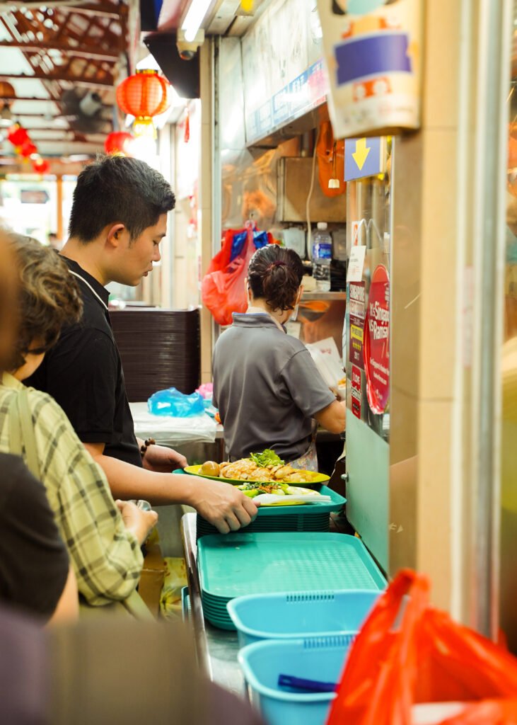 Man getting his tray at food stall